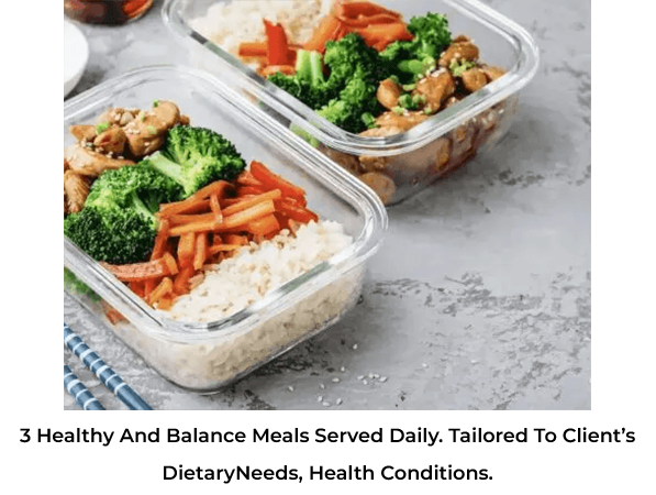Healthy meal prep containers with rice, broccoli, carrots, and chicken.
