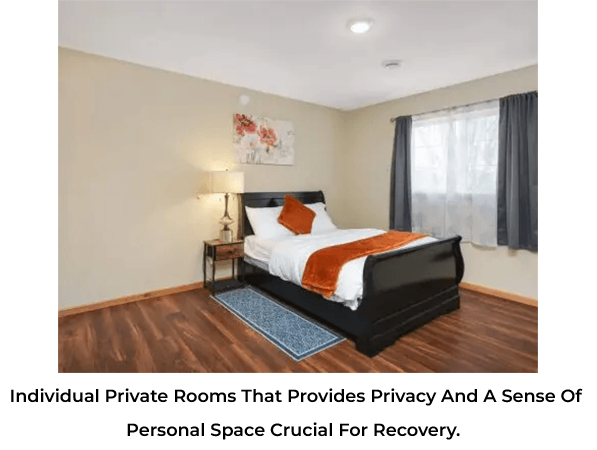 Cozy hotel room with a comfortable bed and warm lighting.