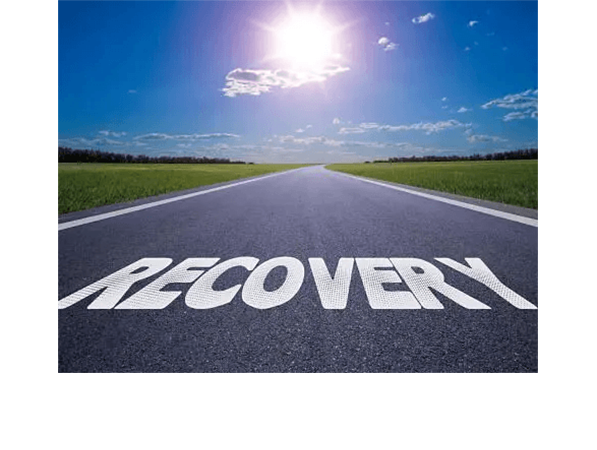 Road with 'RECOVERY' painted, symbolizing a path forward.