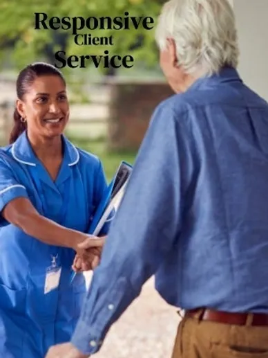 A nurse warmly greeting an elderly person.